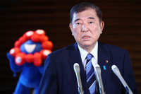 Japanese Prime Minister Shigeru Ishiba speaks to reporters at his office in Tokyo before leaving for Malaysia and Indonesia on Thursday.