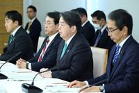 Japanese Chief Cabinet Secretary Yoshimasa Hayashi (second from right) speaks at a ministerial meeting on expanding exports of farm and food products at the prime minister's office in Tokyo on Friday.