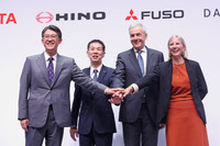 Toyota CEO Koji Sato, Hino CEO Satoshi Ogiso, Mitsubishi Fuso CEO Karl Deppen and Daimler Truck CEO Karin Radstrom pose for a photo after a press conference in Tokyo on Tuesday.