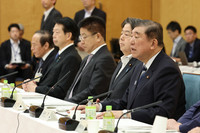 Japanese Prime Minister Shigeru Ishiba (front right) speaks at an economic policy meeting in Tokyo on Friday.