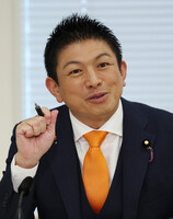Sanseito head Sohei Kamiya speaks in an interview at the Diet on Monday.