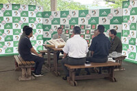 Japanese Prime Minister Shigeru Ishiba (center back) meets with farmers in Shirakawa, Fukushima Prefecture, on Friday.