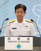 Adm. Akira Saito, chief of staff of the Japanese Maritime Self-Defense Force, speaks at a press conference at the Defense Ministry on Wednesday.