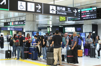 Foreign tourists arrive at Narita International Airport in Chiba Prefecture on June 17.